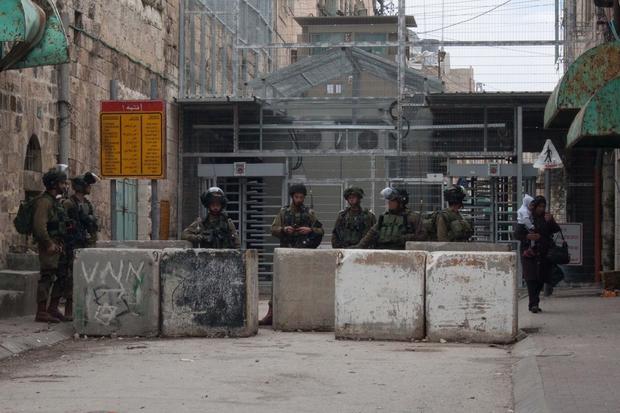 Israeli soldiers at the Shuhada Street checkpoint in Hebron.
