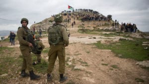 Israeli soldiers standing guard in March at a protest against Israeli settlements in the West Bank.