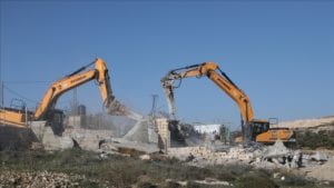 Israeli forces demolishing a house belonging to a Palestinian Jamal Al-Sarsour for allegedly being unauthorized, on February 3, 2021 in Hebron, West Bank.)