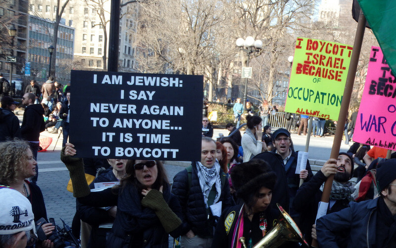 Union Square, New York City. March 8, 2014, a sign reads, "I am Jewish...it's time to boycott"