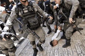 Israeli forces detain Palestinians in front of Jerusalem's Damascus Gate in occupied East Jerusalem on May 18, 2021