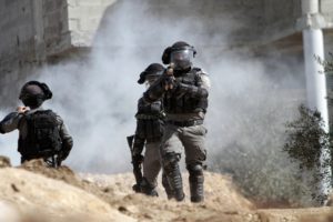 Israeli soldiers fire tear gas at Palestinians protesting Israeli settlements near Nablus, in the West Bank on Feb. 18, 2022. 