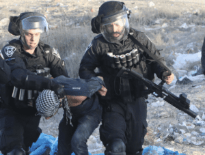 Police arresting a demonstrator in the Bedouin village of Sawa in the Negev, Israel, last month.