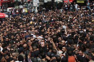 MOURNERS CARRY THE BODIES OF TWO PALESTINIANS WHO WERE KILLED BY ISRAELI FORCES, DURING THEIR FUNERAL, IN THE WEST BANK CITY OF NABLUS ON JULY 24, 2022.
