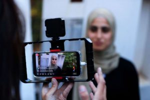 Palestinian activist Mona el-Kurd, 23, talks to reporters at home in Sheikh Jarrah, June 6, 2021.