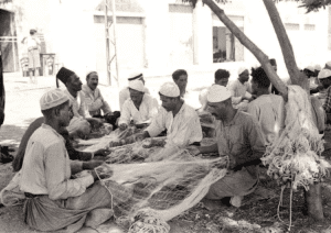TIBERIAS - fishermen repairing their nets, 1935