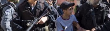 Israeli soldiers arrest a Palestinian child