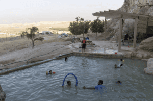 Israeli children swim in a pool at the Jewish settlement of Mevo’ot Yericho, in the Jordan Valley near the Palestinian city of Jericho, Friday, Aug. 11, 2023.