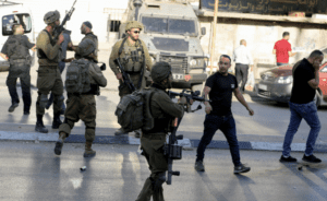 As in Gaza, it's hard to find a safe place in the West Bank. (Pictured: Israeli forces continue to tighten measures at military checkpoints near Nablus in the northern West Bank.