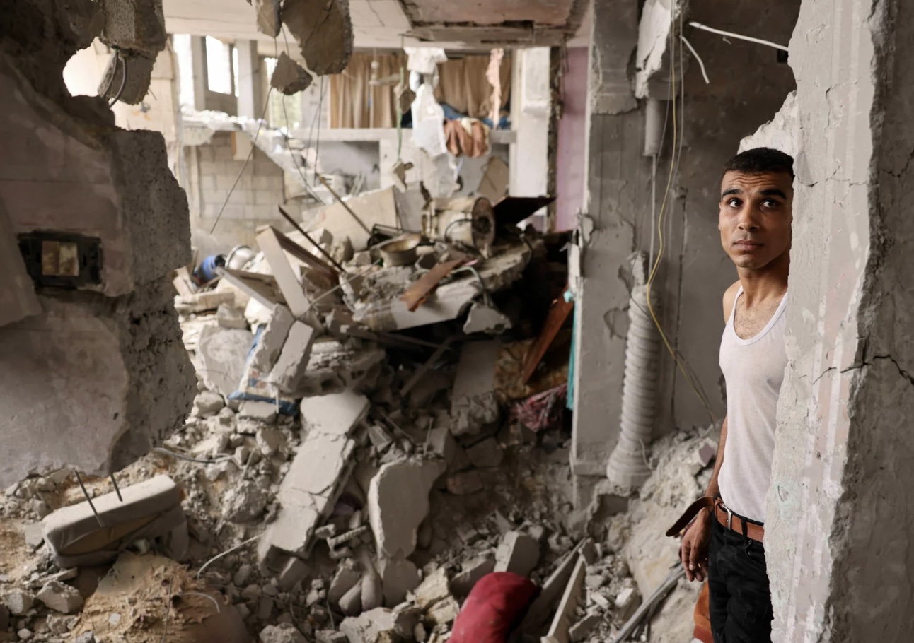 A man stands amid the rubble of a building in the aftermath of Israeli bombing in Rafah in the southern Gaza Strip on Sunday.