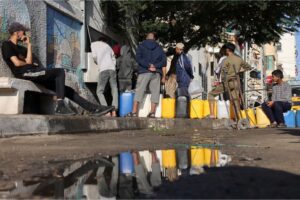 Palestinians queue for clean water in Rafah in the southern Gaza Strip