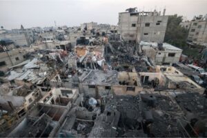Palestinians check the destruction following Israeli bombardment in Rafah, on Tuesday