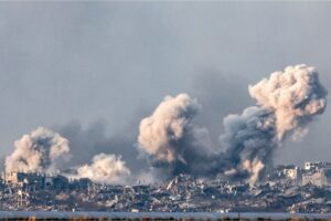 Smoke billows over the northern Gaza Strip during Israeli bombardment on December 14, 2023