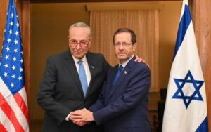 US Senate Majority Leader Chuck Schumer (L) meets with President Isaac Herzog at the Kirya in Tel Aviv, October 15, 2023