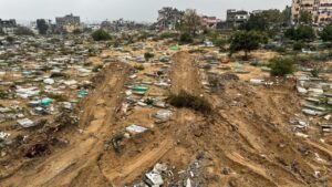 Graves razed during the Israeli ground offensive are seen in the Faluja neighbourhood in the Gaza Strip on 13 December 2023