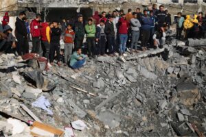 Palestinians view the destruction after an Israeli bombardment of the Gaza Strip