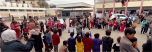 At the central yard of the Jenin Boys School, volunteers from Khan Younis play and sing with the children who come to the school with their displaced families.