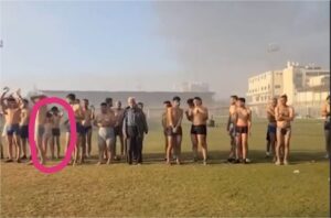 In this screengrab from the recent video, two apparently young boys are seen standing with the adult hostages.