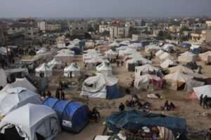 A general view shows Palestinian residents start life in their makeshift tents after leaving their homes in Bureij Refugee Camp in Deir al Balah, central Gaza on December 27, 2023