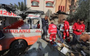 Palestinian Red Crescent personnel check a destroyed ambulance in Deir el-Balah in the central Gaza Strip, on January 11, 2024.