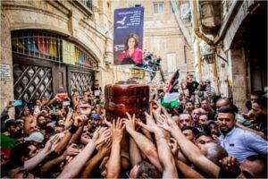 Mourners carry the coffin of the Al Jazeera journalist Shireen Abu Akleh during the funeral procession in Jerusalem.