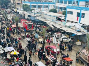 Palestinians shop for food and clothes they can afford at the local bazaar as daily life continues in the shadow of war in Jabalia, January 15
