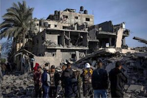 Palestinians inspect the damage to residential buildings where two Israeli hostages were reportedly held before being rescued during an operation by Israeli security forces in Rafah, southern Gaza Strip, Monday.