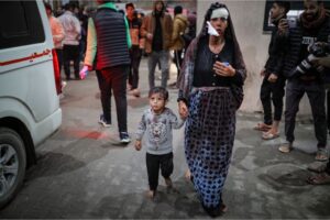 A wounded woman and her child at the Kuwaiti Hospital following Israeli attacks on Rafah