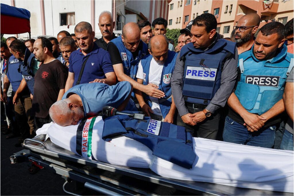 Mourners at the funeral of Palestinian journalist Mohammed Abu Hatab.