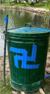 An act of vandalism in Highland Park, IL, in which a swastika and other antisemitic text were left on a trash can, May 2023