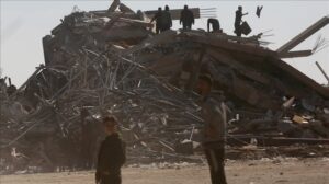 Palestinians, who had returned to the area, try to gather salvageable belongings from the debris of their destroyed homes as Israeli attacks caused great damage in Zawaida region of Deir Al-Balah, Gaza on January 20, 2024.