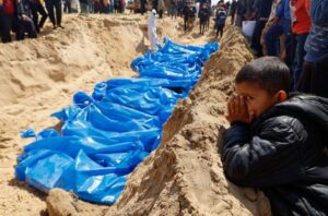 Palestinians killed in Israeli strikes buried in mass grave in Rafah, Gaza