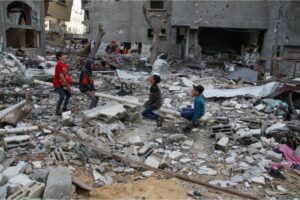 Children play among the ruins of Gaza City during Eid al-Fitr