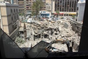 Rubble is cleared from the deadly strike April 1 on an Iranian diplomatic building in Damascus, Syria.