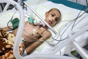 A child hospitalized with a gunshot wound at the European public hospital near Rafah, Gaza, in February 2024.