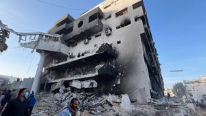 Palestinians gathered around the burned and destroyed al-Shifa Hospital after Israeli forces withdrew.