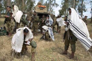 Israeli soldiers of the Jewish Ultra-Orthodox Netzah Yehuda battalion hold morning prayers in 2014