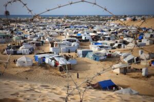 April 22, 2024: As Israeli attacks continue on Gaza, Palestinians who left their homes and took refuge in Rafah try to survive under harsh conditions in makeshift tents they set up in the empty land.