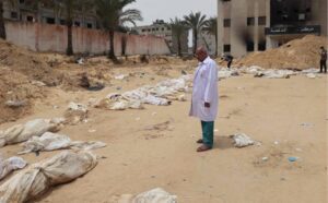 Among the grisly discoveries around Nasser Hospital was the mutilated body of a young girl in a surgical gown, suggesting she may have been buried alive, alongside another victim similarly attired.