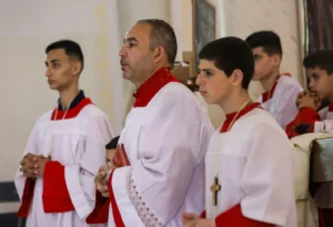 Palestinian Christians celebrating Easter Sunday Mass at the Catholic Holy Family Church last month.