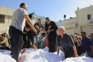 Mourners attending a funeral for Palestinians killed in an Israeli airstrike that damaged the Greek Orthodox Church of Saint Porphyrius in Gaza City, last October.