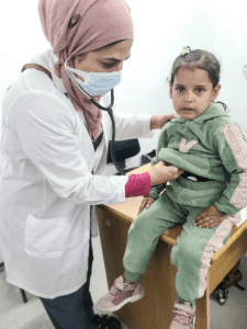 Dr Fozia Alvi cares for a child at the European hospital near Rafah, Gaza, in February 2024.