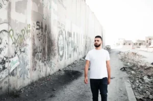 Khalil Sayegh in the West Bank by the separation wall.