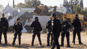 Israeli bulldozers, backed by Israeli police, demolish Palestinian homes near the Umm Butin village in the Negev region on 8 May 2024