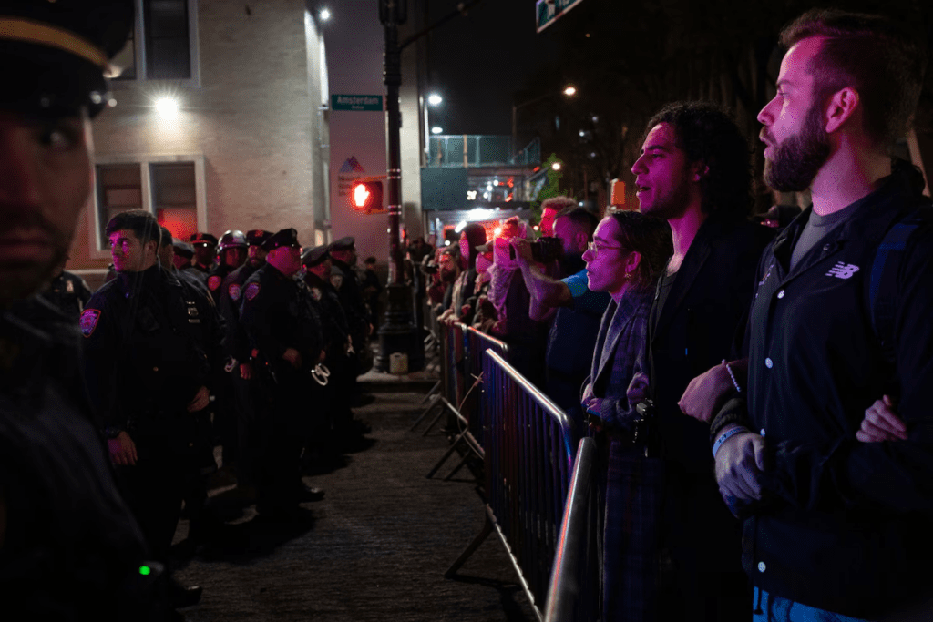Pro-Palestinian protesters chant slogans while facing off against the New York Police Department at Columbia University in late April.