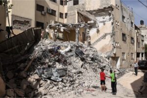 Palestinian children check a destroyed building in the aftermath of the Israeli raid on Jenin