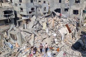 Palestinians look at the destruction after an Israeli air strike in Rafah, Gaza Strip, on April 29, 2024
