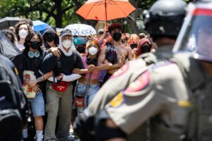 Law enforcement form a circle around the encampment of pro-Palestinian protestors on April 29, at the University of Texas at Austin.