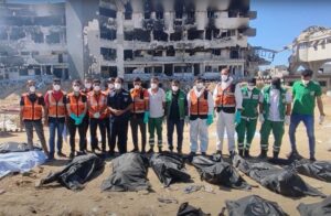 Civil defense teams in Gaza are pictured after discovering a third mass grave in the vicinity of al-Shifa hospital on 8 May 2024