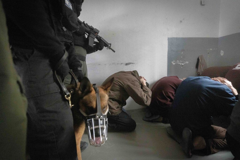 Members of the Keter unit, an Israeli Prison Service response unit, seen during an operation at a prison in southern Israel, February 14, 2024.